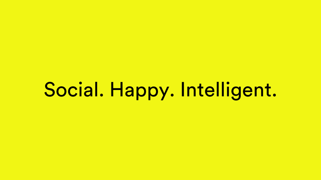 Black text on a yellow background - "Social. Happy. Intelligent."