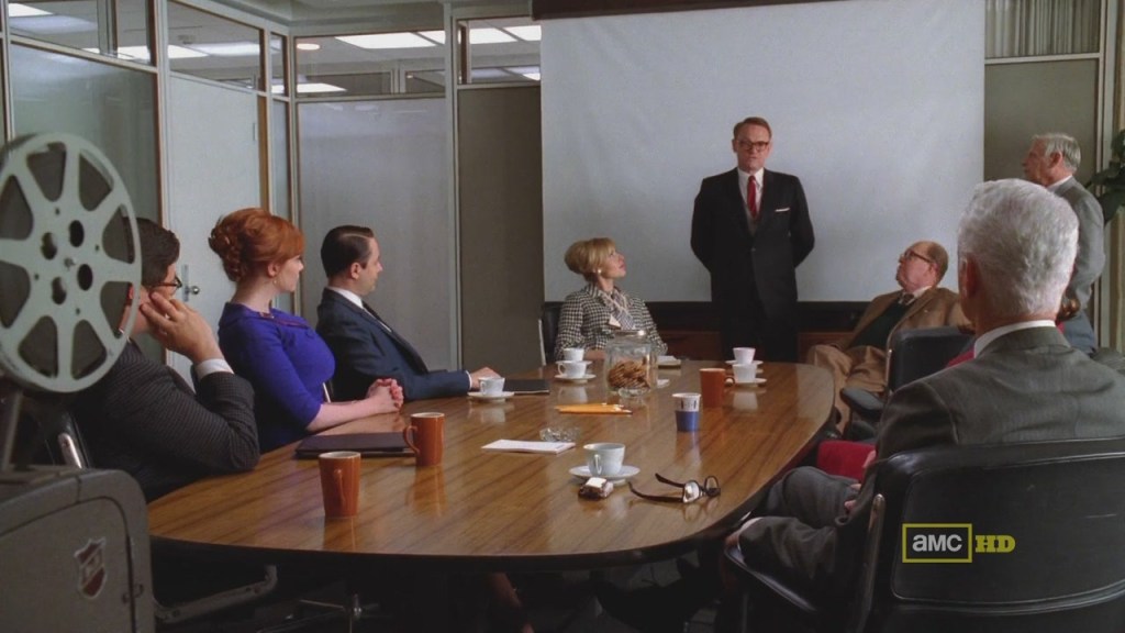 A group of people in a meeting - Mad men - projector -screen-suits-creative-amc HD