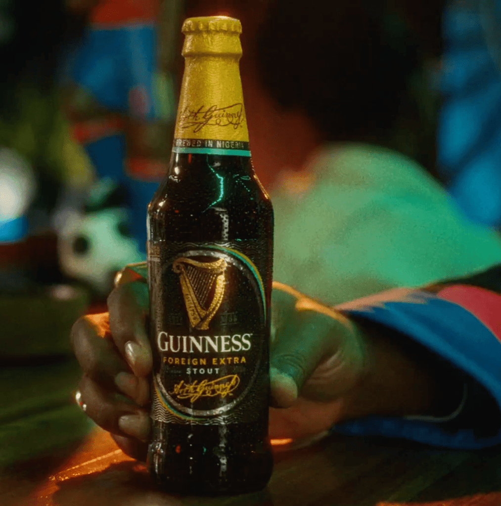 In Guinness's viral marketing campaign, African football fans holding Guinness beer bottles in their hands. 
