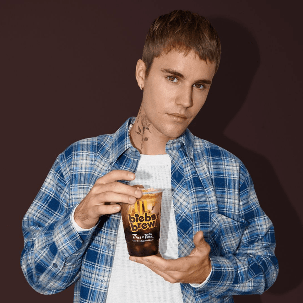 In this viral marketing campaign, Justin Bieber holding his "Biebs Brew" drink, a collaboration with Tim Hortons.
