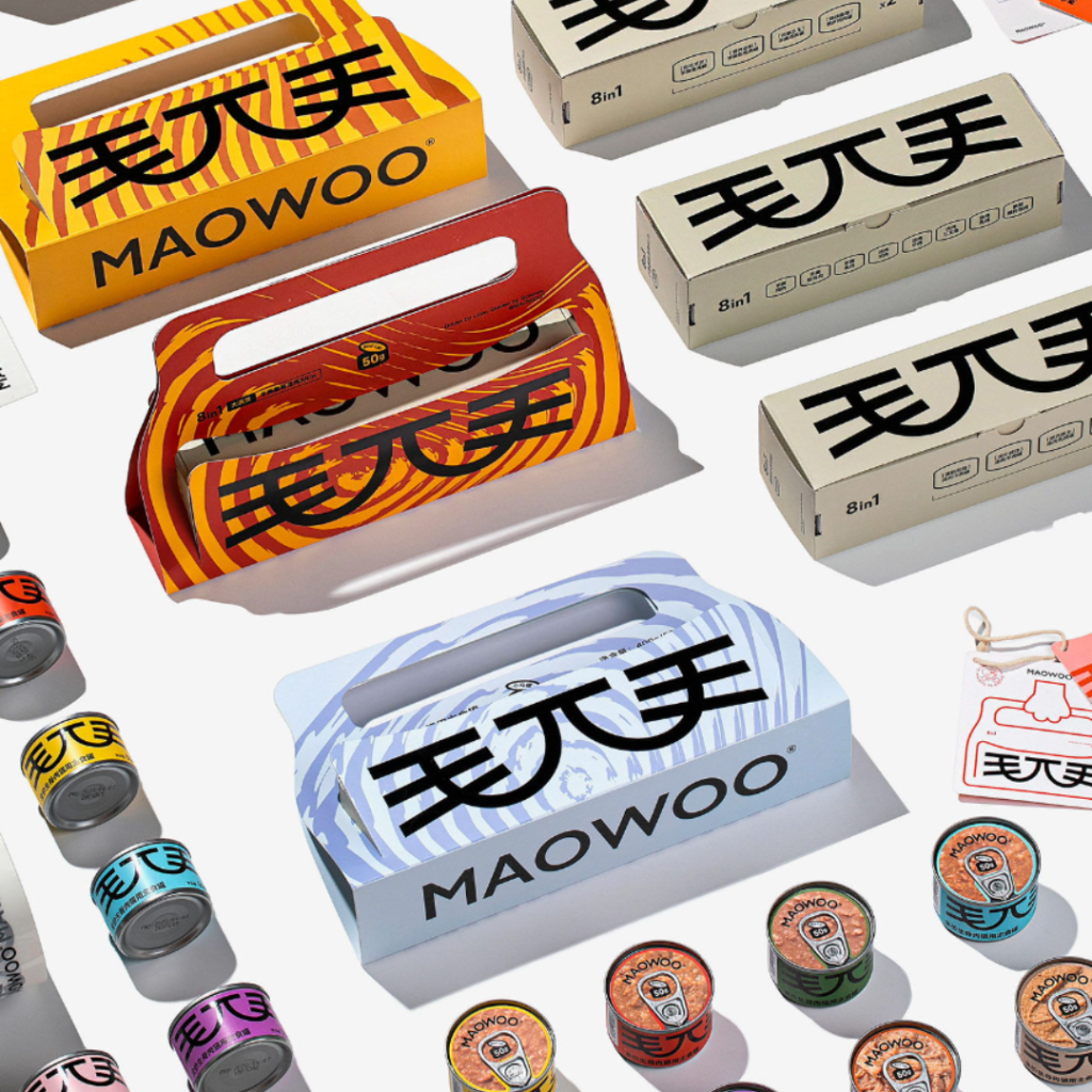 The packaging uses a simple color palette and the Chinese character "毛兀" to create a cute cat face.